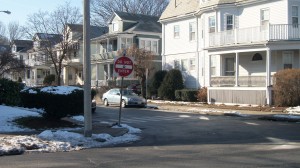 The suspect's car reportedly struck a curb at Powder House Blvd. and Leonard St., where the occupants exited the vehicle and fled on foot.