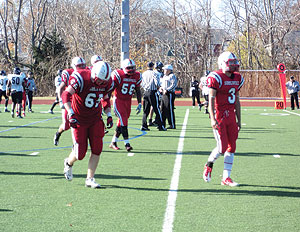 Ryan Conte, 65 (left), and Phoenix Huertas, 3 (right), seen leaving the field on Thanksgiving Day, are headed in different directions in 2013. Both are looking forward to new challenges.