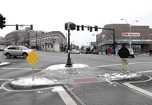 What’s missing from this scene? Many say that a new sign for Magoun Square is a “must have” item in the near future. ~Photo by Bobbie Toner