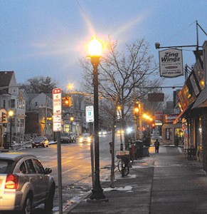 Streetlights are turned on earlier in Ball Square. to accommodate early morning walkers and runners. ~Photo by Bobbie Toner