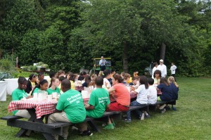 Students made and enjoyed veggie flatbread pizzas with the First Lady  following the harvest (Healey students in white t-shirts; Lana Popovic in peach  shirt, green high-tops) 