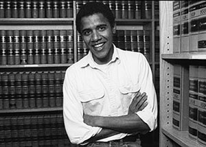 Barack Obama stands in the law library at Harvard University c.1989. Photo Courtesy of Harvard University.