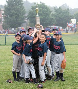 Minor league champs Boston Closet celebrate with the championship trophy.