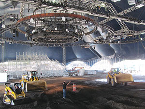 Cavalia is using heavy equipment to build a mountain landscape under the “big white top.” ~Photo by Elizabeth Sheeran.