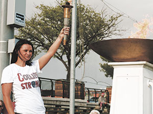 Sean Collier’s sister, Jenn Rogers, lit the ceremonial flame at this year’s Somerville Special Olympics event. ~Photo by Karalyn Connolly 